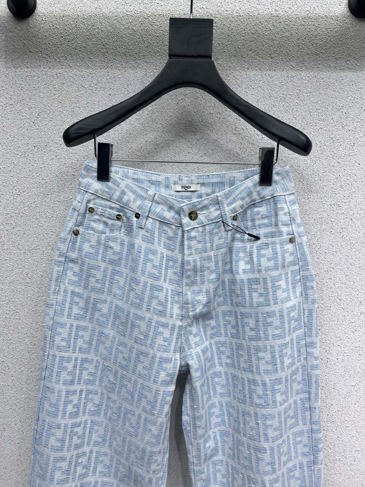 25 Jacquard printed monogram denim trousers