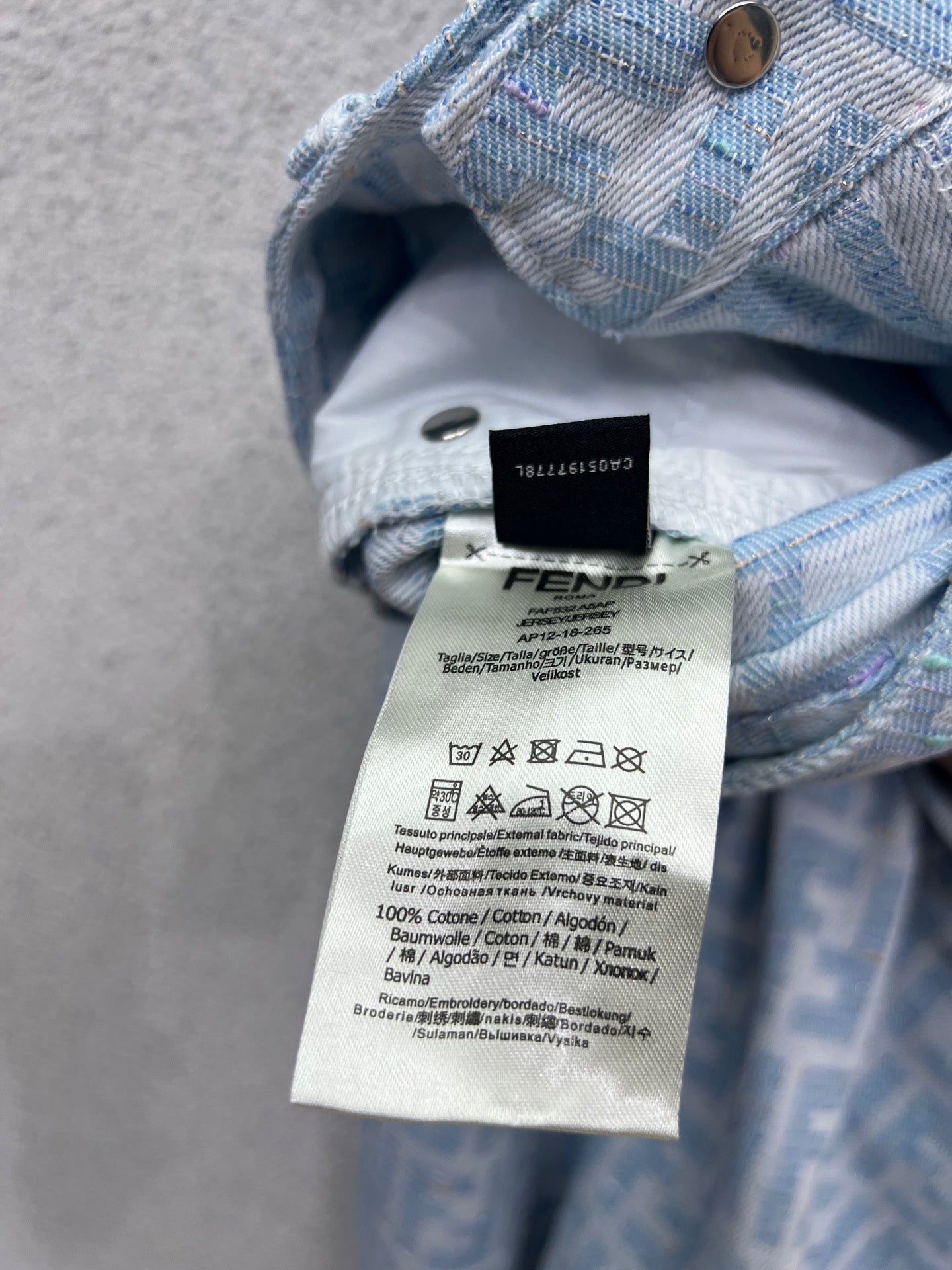 25 Jacquard printed monogram denim trousers